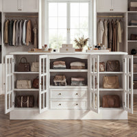 White kitchen island with glass cabinet doors, open shelves, and center drawers