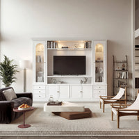 White entertainment center with open TV space, glass side cabinets, lower storage cabinets, and drawers
