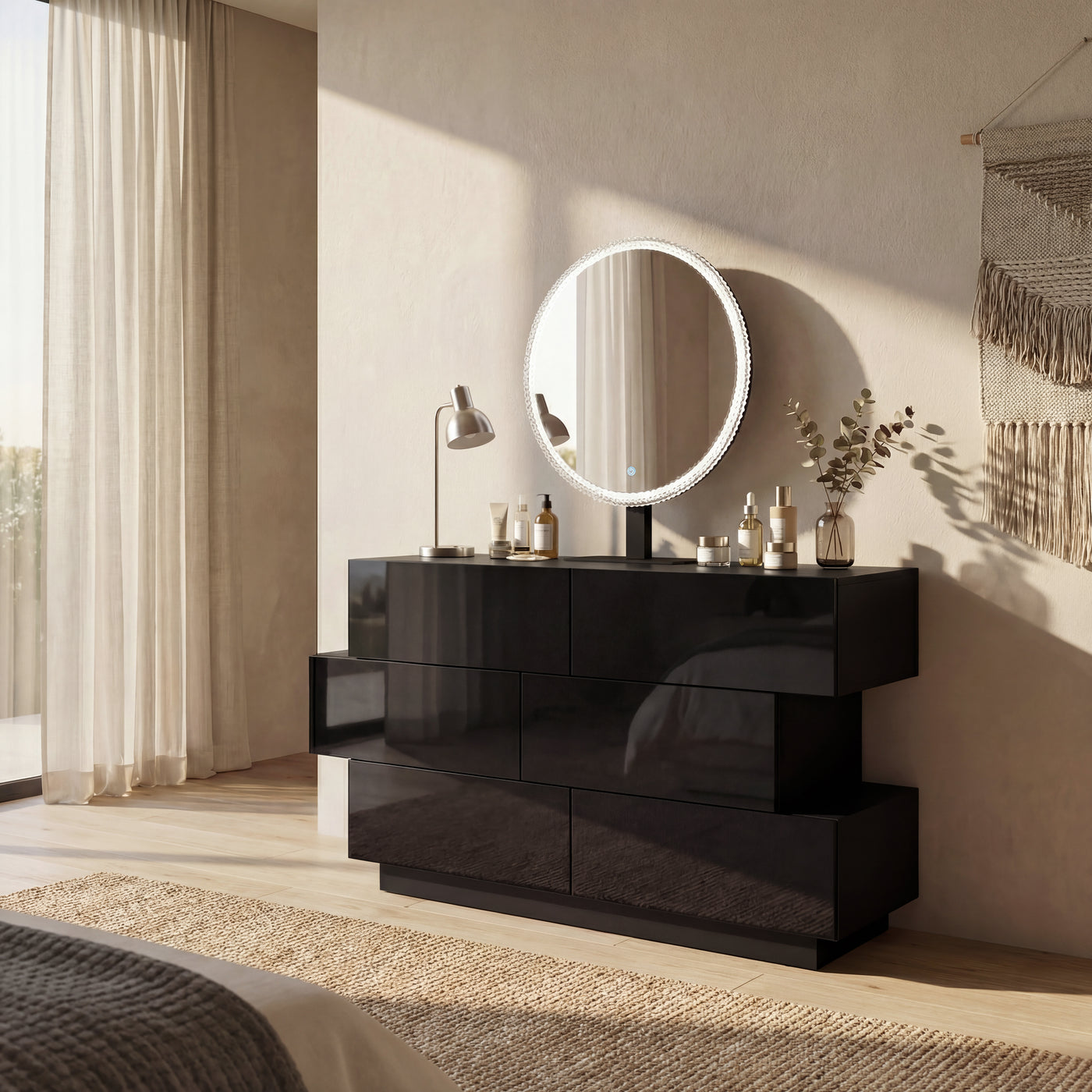 Black high-gloss dresser with wide drawers and vanity mirror setup