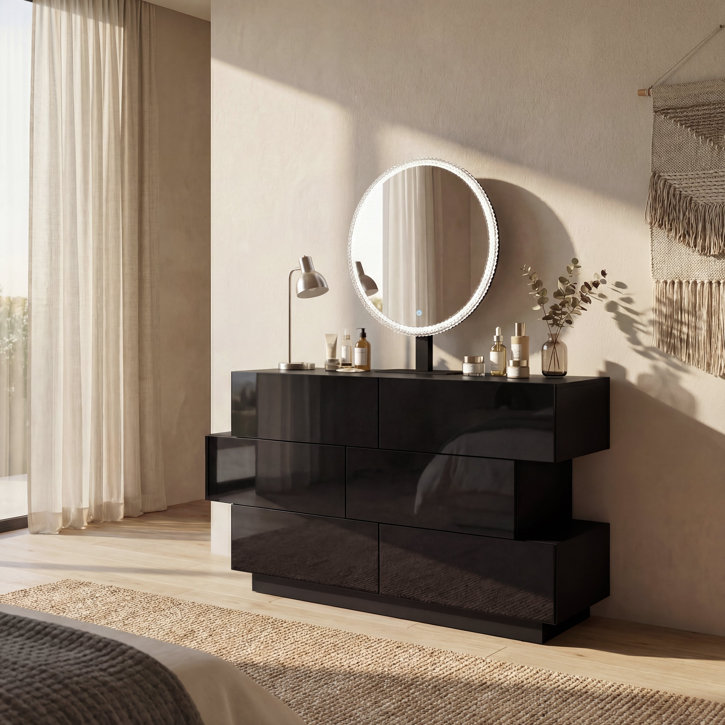 Black high-gloss dresser with wide drawers and vanity mirror setup