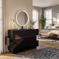 Black high-gloss dresser with wide drawers and vanity mirror setup