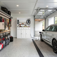 White garage storage cabinet with countertop, tool wall, and lower doors