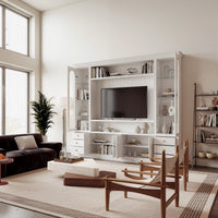 White entertainment center with open TV space, glass side cabinets, lower storage cabinets, and drawers