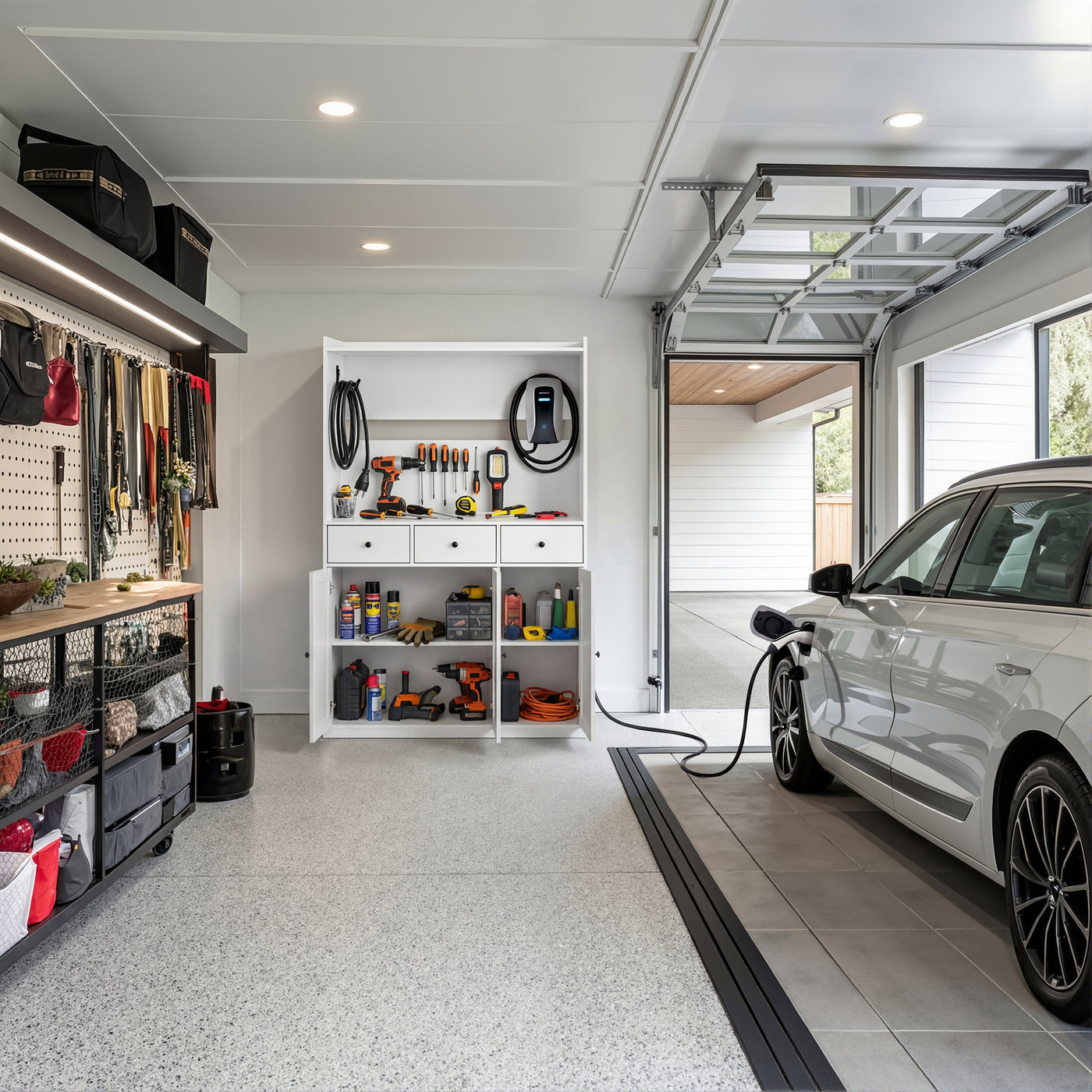 White garage storage cabinet with countertop, tool wall, and lower doors