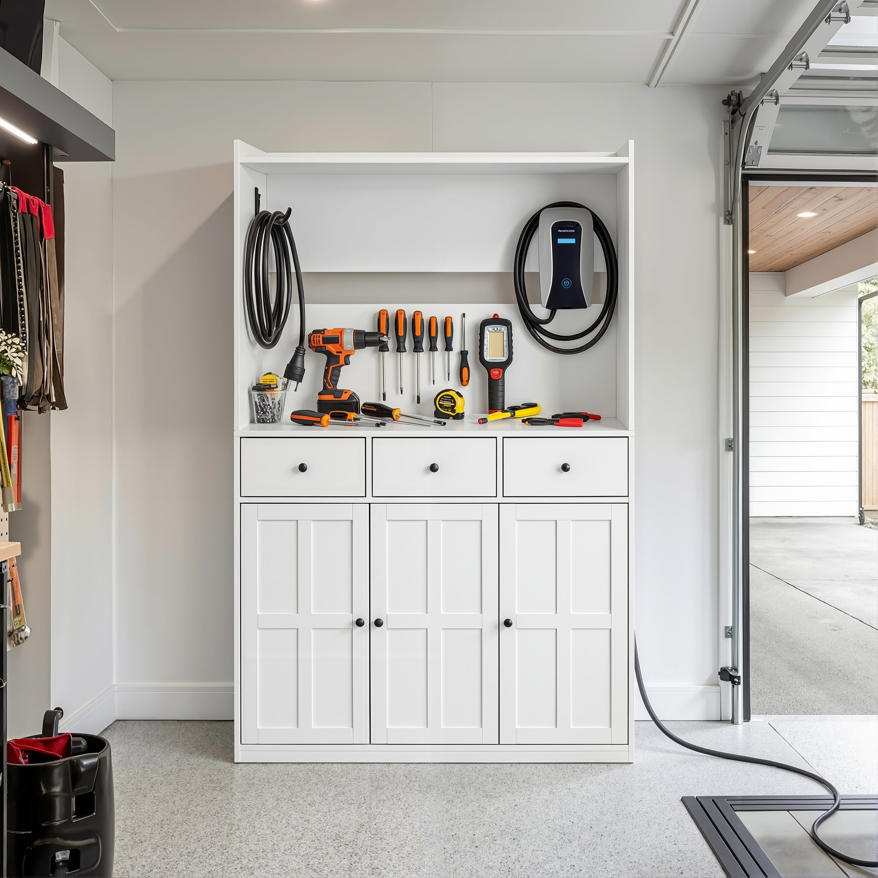 White garage storage cabinet with countertop, tool wall, and lower doors