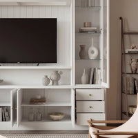 White entertainment center with open TV space, glass side cabinets, lower storage cabinets, and drawers