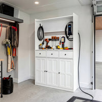 White garage storage cabinet with countertop, tool wall, and lower doors