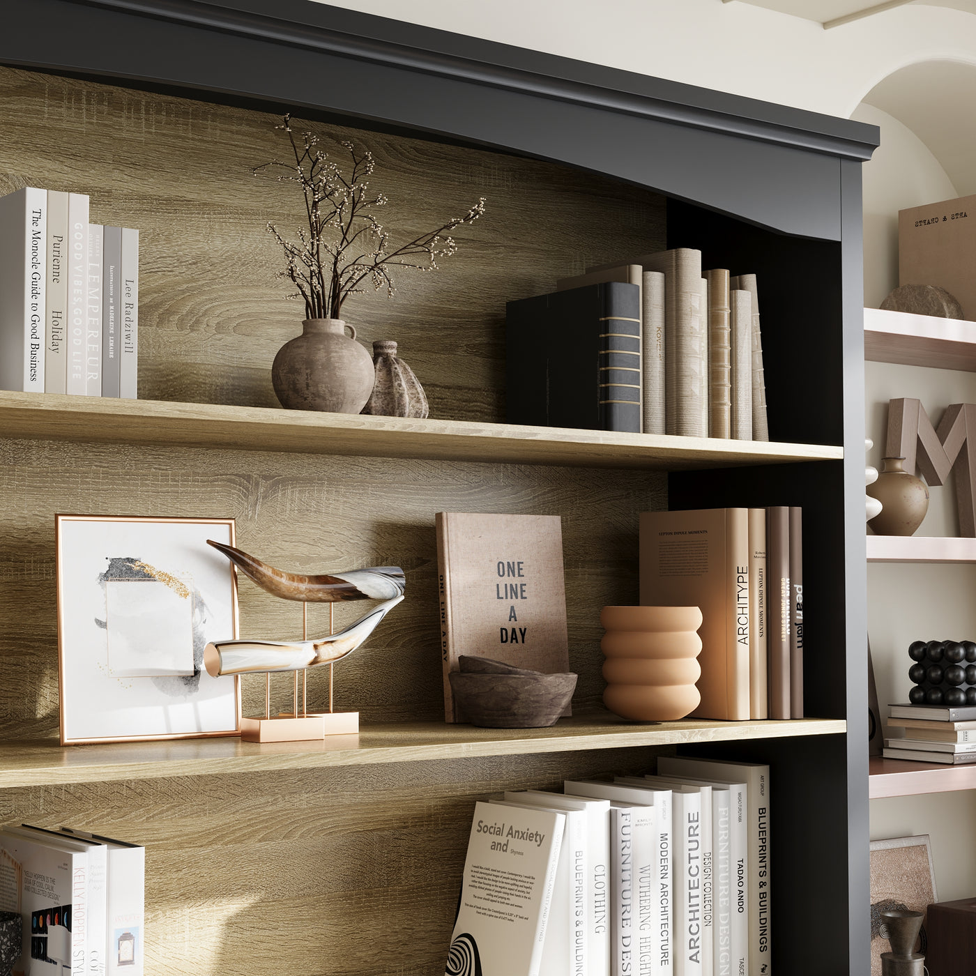 Bookshelf with decorative items including books, vases, and a small plant.