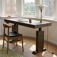 Dark wood standing desk with electric height adjustment and control panel
