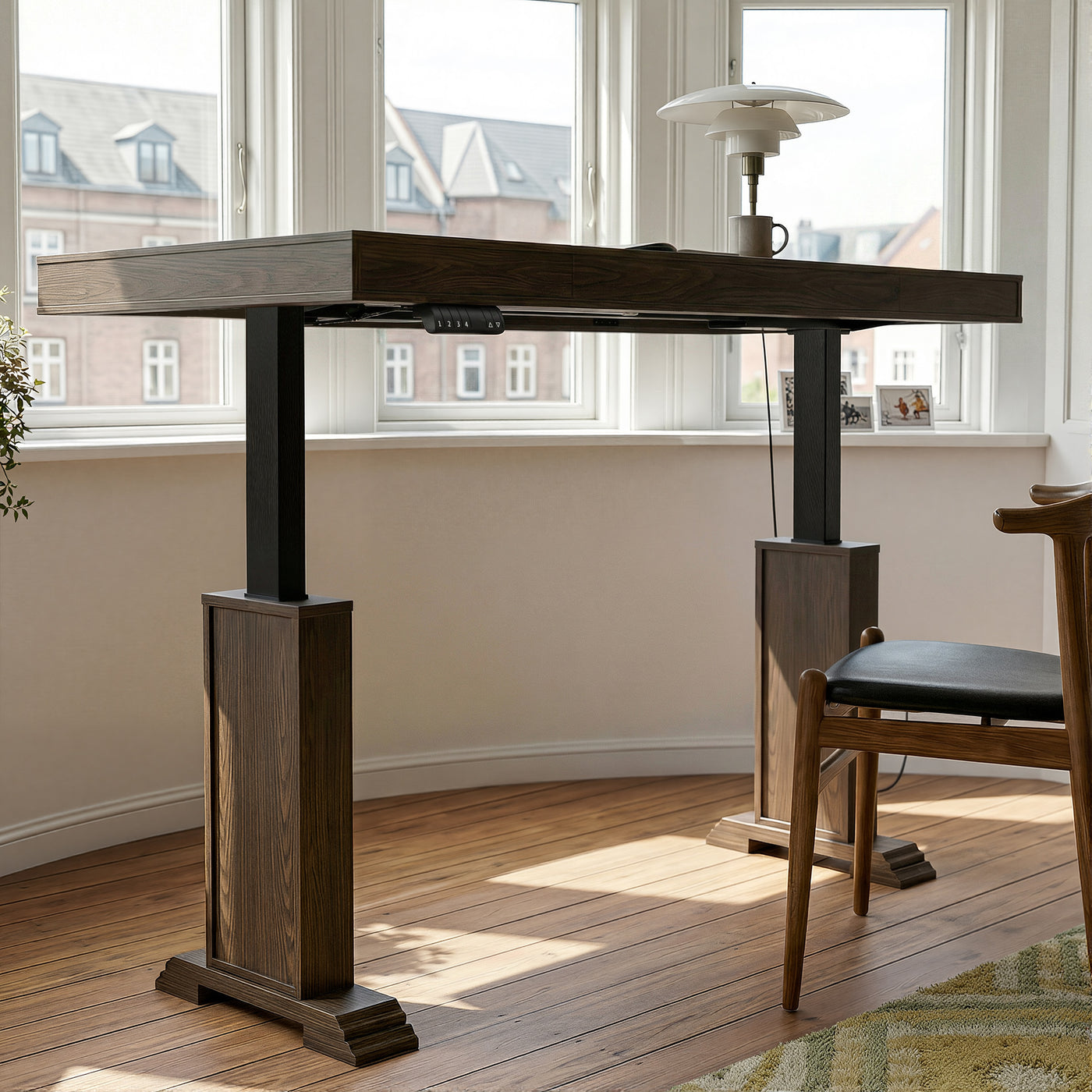 Dark wood standing desk with electric height adjustment and control panel